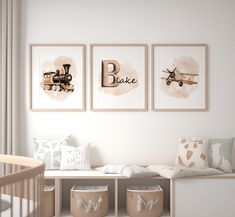 a baby's room with three framed pictures on the wall and toys in baskets