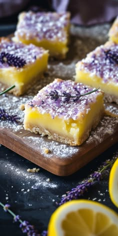 lemon bars with lavender sprinkles on a cutting board