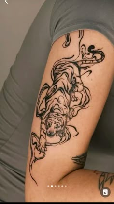 a woman with a tattoo on her arm