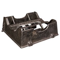 an old cast iron money box on a white background