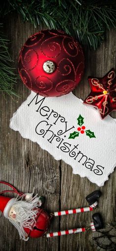 a christmas ornament and other decorations on top of a wooden table