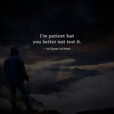 a man standing on top of a mountain with a quote above him that reads, i'm patient but you better not test it