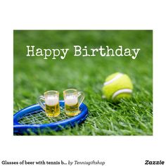 two glasses of beer sit on a tennis racket with a ball in the background