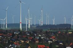 many windmills are shown in the distance