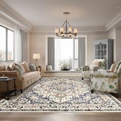 a living room with couches, chairs and a rug on the floor in front of large windows