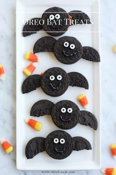 oreo bat treats on a plate with candy