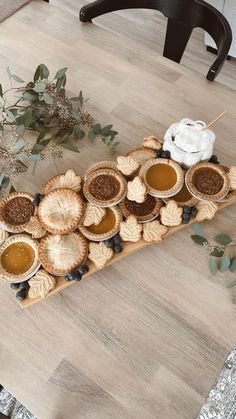 there are many pies on the table ready to be eaten and served for guests