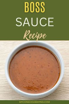 a white bowl filled with sauce on top of a wooden table