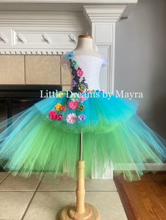 Welcome to Little Dreams by Mayra This dress is absolutely adorable and puffy! Just perfect for any birthday party, halloween, pageant or any occasion , your little one will look just adorable! Dress has three layers of tulle, Top has a handmade design in the front of the top only *If you need a different color just send me a message When selecting length you will select the longer layer in the back from armpit to floor, the front of the dress is shorter, if you wish to have the whole dress one length just let me a note at checkout  5'' crochet top will be used for sizes nb to 2T 8'' crochet top will be used for sizes 3T to 8years 10''crochet top will be used for sizes 9-10years 12''crochet top will be used for sizes 12years Shipping My orders are usually ready to ship in 7 business days, Whimsical Green Tutu Dress For Dress-up, Spring Fairy Style Tutu Dress With Tulle Skirt, Princess Style Fairy Dress For Costume Party In Spring, Fairy Kei Dress For Spring Dress-up, Cute Fairy Dress For Costume Party, Spring Princess Dress In Tulle For Costume Party, Fitted Fairy Dress For Spring Pageant, Cute Fitted Fairy Dress For Costume Party, Spring Tulle Princess Dress For Costume Party