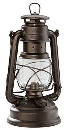 an old fashioned oil lamp on a white background