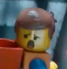 there is a lego man with a red hat and yellow jacket on holding a blue cup