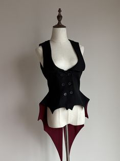 Make a statement with the Black and Red Gothic Lolita Bat Wings Hemline Waistcoat! This unique piece features a striking color combination and a hemline reminiscent of bat wings, adding a touch of gothic flair to your outfit. Perfect for lovers of lolita fashion who want to stand out from the crowd.   	 		 			Size 			S 			M 			L 			XL 		 		 			Bust 			80 			84 			88 			92 		 		 			Full Length 			50-92 			51-93 			52-94 			53-95 		 		 			Waist 			68 			72 			76 			80 White Black And Red Outfit, Gothic Ren Faire Outfit, Gothic Clothing Ideas, Cute Vampire Outfit, Bat Themed Outfit, Gothic Clown Outfit, Vampiric Outfits, Vampire Clothes Women, Devil Outfit Aesthetic