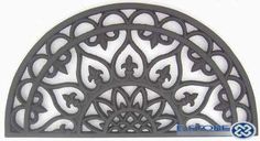 an ornate iron wall decoration on a white background