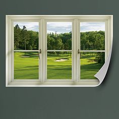 an open window with the view of a golf course