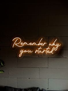 a neon sign that reads, remember why you started