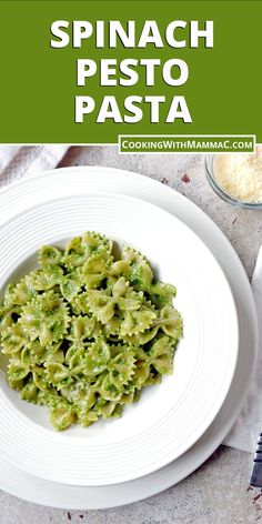 spinach pesto pasta on a white plate