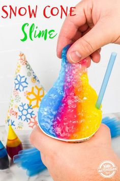 someone is holding a plastic cone shaped like a cone with the words snow one slime on it