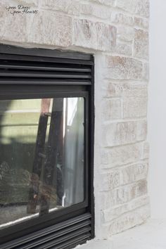 a brick fireplace with a window in it