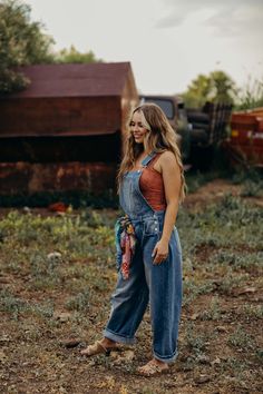 The Flynn Overalls offer a stylish and versatile option for your fall wardrobe. With a barrel jean fit and loose silhouette, these cowgirl overalls provide both comfort and fashion. Made from durable denim, they are perfect for back to school or any casual occasion. Courtney is wearing size small paired with The Kristan Tank Cowgirl Overalls, Overalls Outfit Fall, Farmer Overalls, Denim Overalls Outfit, Painted Overalls, Overalls Outfits, Farmer Outfit, Jean Fit, Overall Outfit