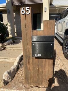 the mailbox is made out of wood and metal