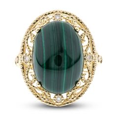 A mesmerizing oval natural malachite cabochon is haloed by exquisite filigree patterns and shimmering round diamonds in this captivating women's ring. Even more fiery round diamonds punctuate the band to complete the look. Fashioned in 14K yellow gold, the total diamond weight of the ring is 1/20 carat. Malachite Ring, Malachite Rings, Filigree Pattern, Jared The Galleria Of Jewelry, Fashion Rings, Women Rings, Round Diamonds, Halo, Gemstone Rings