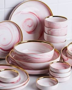 pink and white marble dinnerware set with gold rims