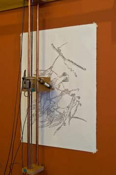 a drawing on the wall with wires attached to it