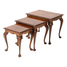 three wooden tables sitting on top of each other