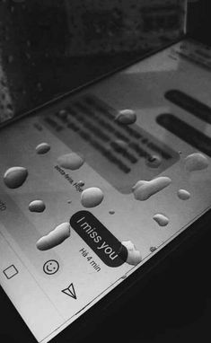 a close up of an electronic device with buttons and numbers on the display screen in black and white