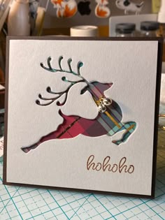 a close up of a greeting card with a reindeer on it's head and the words holsha written in gold