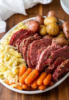 corned beef, potatoes and carrots on a plate