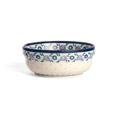 a blue and white bowl with flowers on it