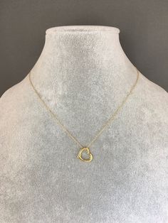 "A sweet and elegant floating 24k gold vermeil heart charm is simply suspended from a fine 14k gold filled chain. The chain measures 16\" with an extension to 18\" and is finished with a gold spring ring clasp. Please send a message if a different length chain is desired. A wonderful gift for a bride, best friend, or anniversary! Floating heart charm: 13x12mm Total length of charm: 1/4\" Gold chain: 1mm This necklace is also available in silver... www.etsy.com/listing/1076790169/silver-heart-nec Open And Close Heart Necklace, Delicate 14k Gold Open Heart Charm Necklace, Delicate Yellow Gold Heart Necklace With Round Pendant, Minimalist Yellow Gold Plated Heart Necklace, Minimalist Yellow Gold-plated Heart Necklace, Gold Minimalist Open Heart Charm Necklace, Delicate Yellow Gold Heart Pendant Charm Necklace, Minimalist Gold Open Heart Charm Necklace, Yellow Gold Heart Necklace As Gift For Her