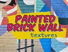 a painted brick wall with the words textures on it in front of a colorful mural