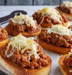 several sloppy joes are sitting on a plate