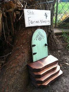 a wooden chair sitting on top of a pile of wood next to a sign that reads shr farness sleeping