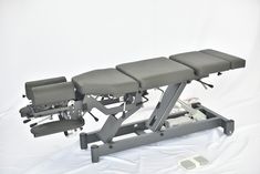 a medical table with three chairs on it