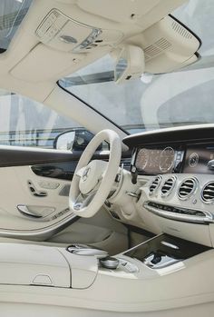 the interior of a mercedes s - class sedan with its steering wheel and center console