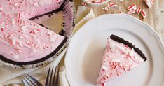 a slice of peppermint ice cream pie on a plate next to a fork