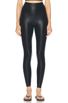 87% polyester 13% elastane.  Made in USA.  Machine wash.  High-waisted fit.  Logo detail at back.  Shiny coated fabric.  Item not sold as a set.  .  .  .  .  .  .  .  .  . Luxury Body Wash, Cut Out Leggings, Fit Logo, Shiny Leggings, Black Houndstooth, Athleisure Wear, Beyond Yoga, Fine Fabric, Yoga Leggings