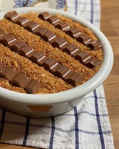 a bowl filled with chocolate on top of a table