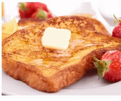 two pieces of french toast with butter and strawberries