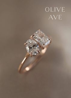 Lawson | 14k Gold | 7x5mm Oval Moissanite | 7x5mm Emerald Radiant Cut Moissanite | #vintage #rosegold #diamonds Olive Avenue Jewelry, Cathedral Setting, Emerald Cut Moissanite, Oval Moissanite, Forever One Moissanite, Radiant Cut, Engraved Items, Jewelry Companies, Perfect Ring