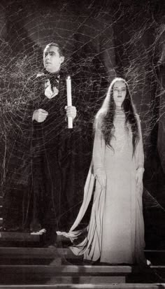 a man and woman standing next to each other in front of spider webs with the caption oh that, i've been surfing the web