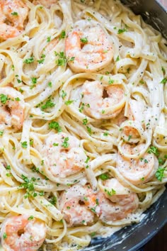 pasta with shrimp and parsley in a skillet