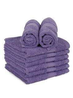 a stack of purple towels sitting on top of each other