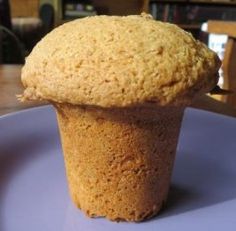 a close up of a muffin on a plate