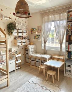 a child's room with bunk beds, desks and shelves filled with toys