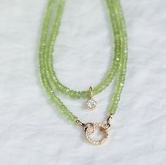 "This necklace is available as a regular 16-18\" piece with clasp and extender or as a strand with open jump rings [to wear with a carabiner style clasp] Peridot opens our hearts to joy and new relationships. It enhances confidence and assertion, motivating growth and change D E T A I L S △ Handmade in Vancouver △ Option 1: 14k gold filled clasp and extender 16-18\" △ Option 2: Strand with open jump rings 16\" [white topaz carabiner not included] △ Faceted rondel cut genuine peridot 3-4mm △ Gemstones are 100% genuine  White topaz pendant add on available here: www.etsy.com/ca/listing/1538766506 White topaz carabiner: www.etsy.com/ca/listing/1539373762 All carabiners and pendants:  https://www.etsy.com/ca/shop/EarthlyAbundanceGems?ref=seller-platform-mcnav§ion_id=33816756 Q U A L I T Y  The Green Peridot Necklace For May Birthstone, Peridot Gemstone Beads Necklace As Gift, Peridot Gemstone Bead Necklace For Gift, Peridot Gemstone Beads Necklace For Gift, Green Peridot Jewelry With Gemstone Beads, Green Peridot Gemstone Beads Jewelry, Peridot Gemstone Necklace For May Birthstone, Lime Green Peridot Necklace For May Birthstone, Round Peridot Birthstone Necklace