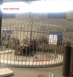 the inside of a building that is being constructed with metal bars and steel wire fencing